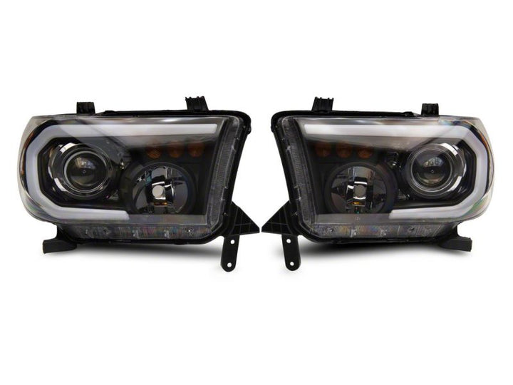 Raxiom 07-13 Toyota Tundra Axial Projector Headlights w/ SEQL LED Bar- Black Housing (Clear Lens)