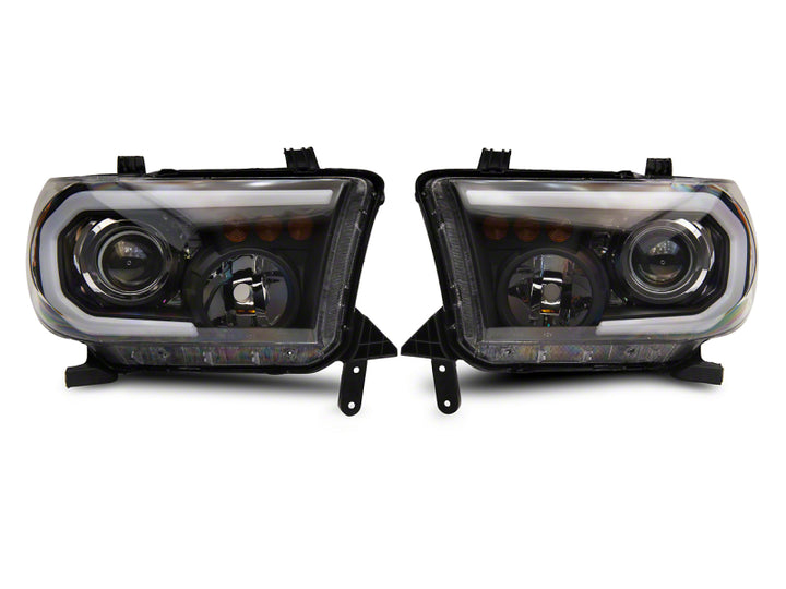 Raxiom 07-13 Toyota Tundra Axial Projector Headlights w/ SEQL LED Bar- Black Housing (Clear Lens)