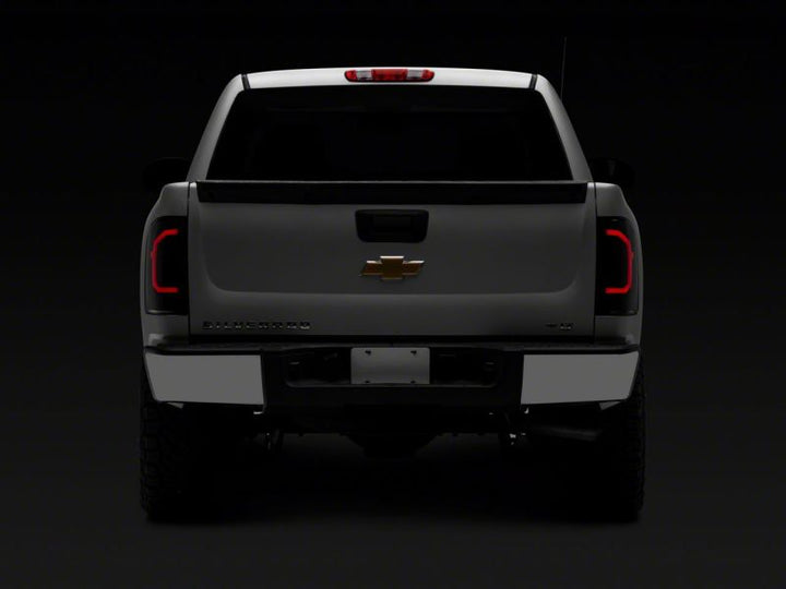 Raxiom 07-14 Chevrolet Silverado 1500 Axial Series LED Tail Lights- Black Housing (Smoked Lens)