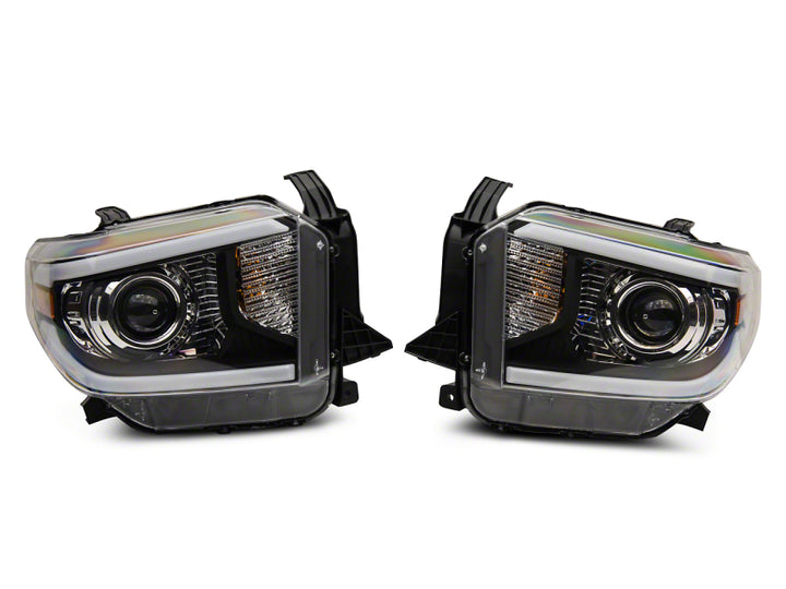 Raxiom 14-21 Toyota Tundra Axial Projector Headlights w/ SEQL LED Bar- Black Housing (Clear Lens)