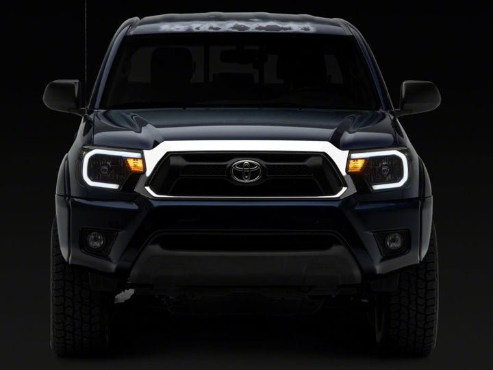 Raxiom 12-15 Toyota Tacoma Axial Series Headlights w/ LED Bar- Black Housing (Clear Lens)