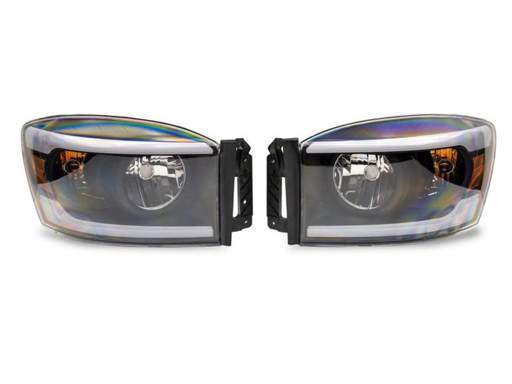 Raxiom 06-09 Dodge RAM 1500/2500/3500 Axial Headlights w/ SEQL LED Bar- Black Housing (Clear Lens)