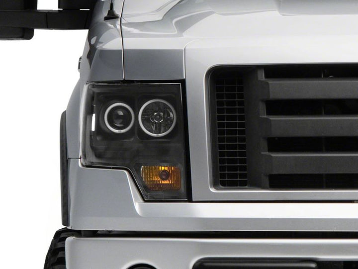 Raxiom 09-14 Ford F-150 Super White LED Halo Projector Headlights- Black Housing (Clear Lens)