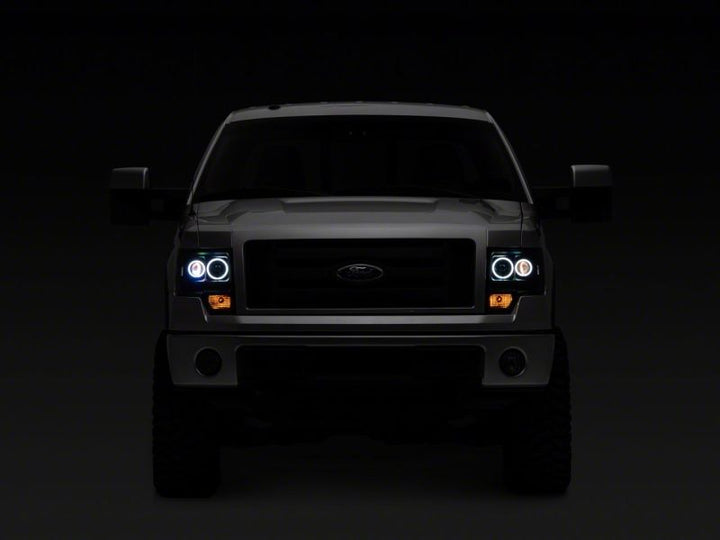 Raxiom 09-14 Ford F-150 Super White LED Halo Projector Headlights- Black Housing (Clear Lens)