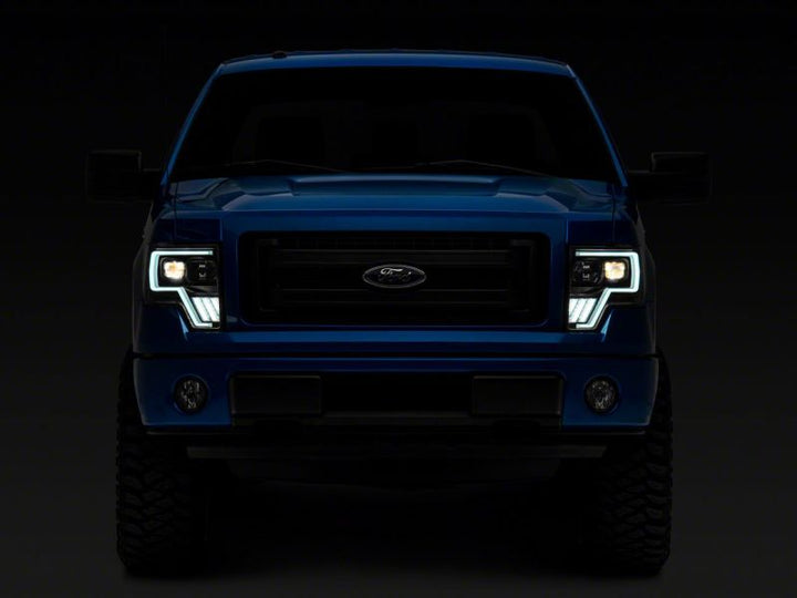 Raxiom 09-14 Ford F-150 Axial G4 Light Bar Switchback Projector Headlights- Blk Housing (Clear Lens)