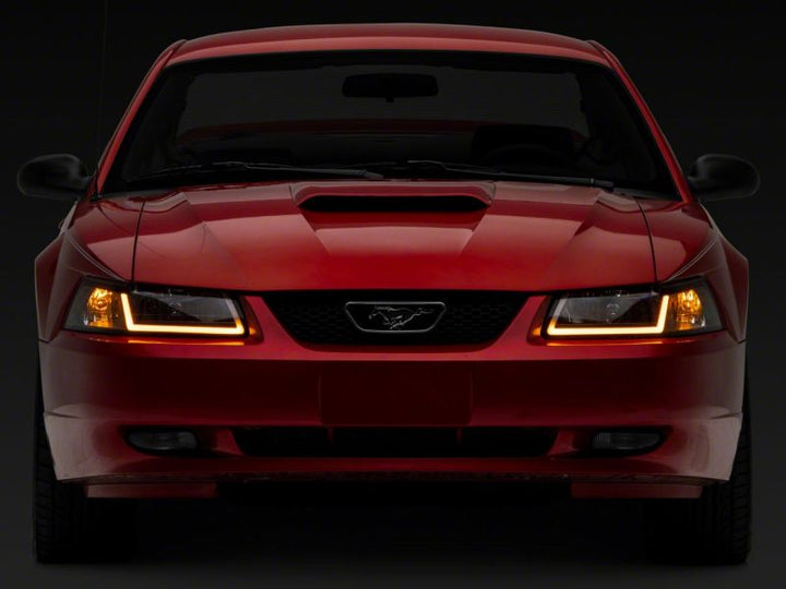 Raxiom 99-04 Ford Mustang Axial Series Headlights w/ Sequential LED Bar- Black Housing (Clear Lens)