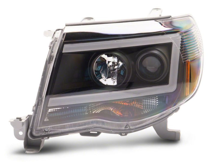 Raxiom 05-11 Toyota Tacoma Axial Series LED DRL Projector Headlights- Black Housing (Clear Lens)