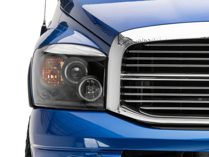 Raxiom 06-08 Dodge RAM 1500 LED Halo Projector Headlights- Black Housing (Clear Lens)