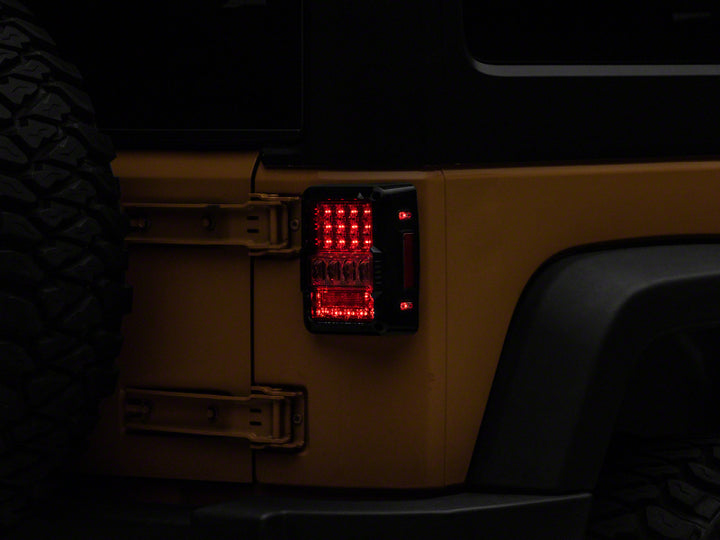 Raxiom 07-18 Jeep Wrangler JK Axial Series Lux LED Tail Lights- Black Housing (Clear Lens)