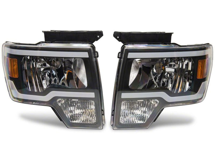 Raxiom 09-14 Ford F-150 Axial Series Headlights w/ LED Bar- Black Housing (Clear Lens)