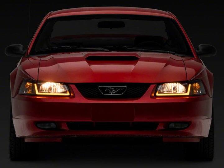 Raxiom 99-04 Ford Mustang Axial Series Headlights w/ Sequential LED Bar- Black Housing (Clear Lens)