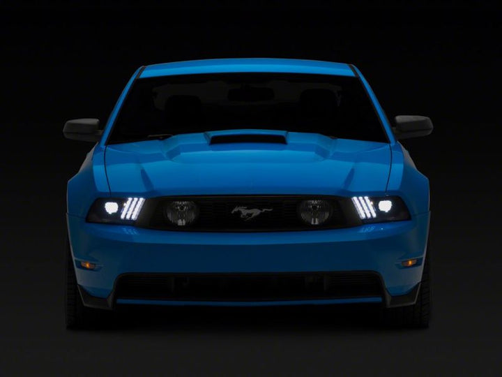 Raxiom 10-12 Ford Mustang LED Projector Headlights SEQL Turn Signals- Black Housing (Clear Lens)